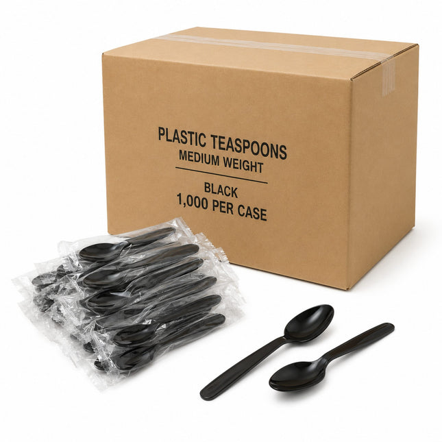 A brown cardboard box labeled 'PLASTIC TEASPOONS MEDIUM WEIGHT BLACK 1,000 PER CASE' with several individually wrapped black plastic teacups in front and two loose black teacups on a white background.