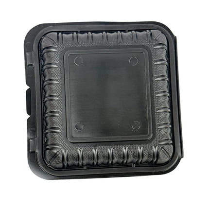 A square black plastic food tray with a textured ribbed outer border and a smooth central lid area, shown on a plain white background.