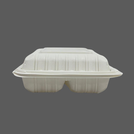 A white biodegradable double-compartment food tray with a matching lid, shown against a solid dark gray background.